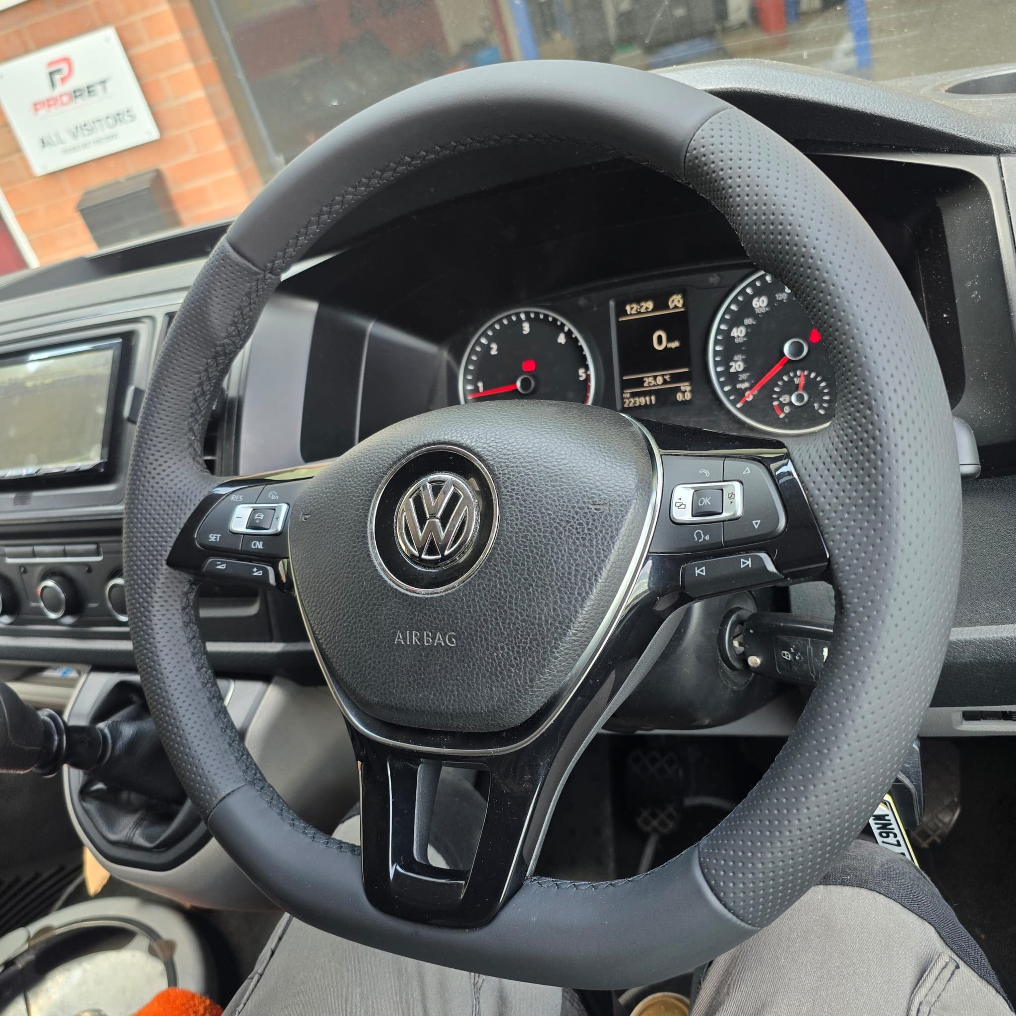 Close-up of Volkswagen Transporter T6 flat-bottom steering wheel retrim in genuine leather