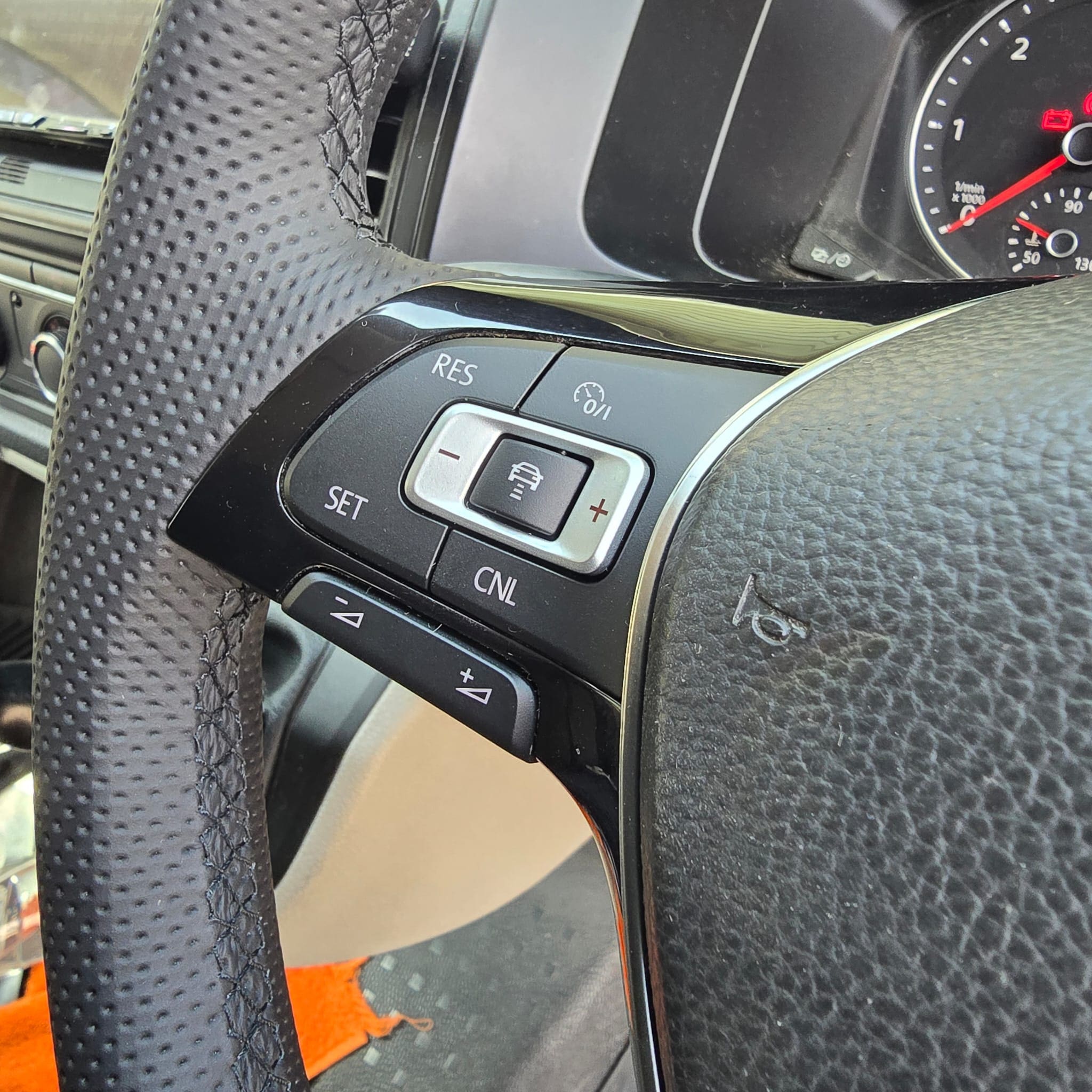 Completed hand-trimmed flat-bottom steering wheel fitted to a Volkswagen Transporter T6