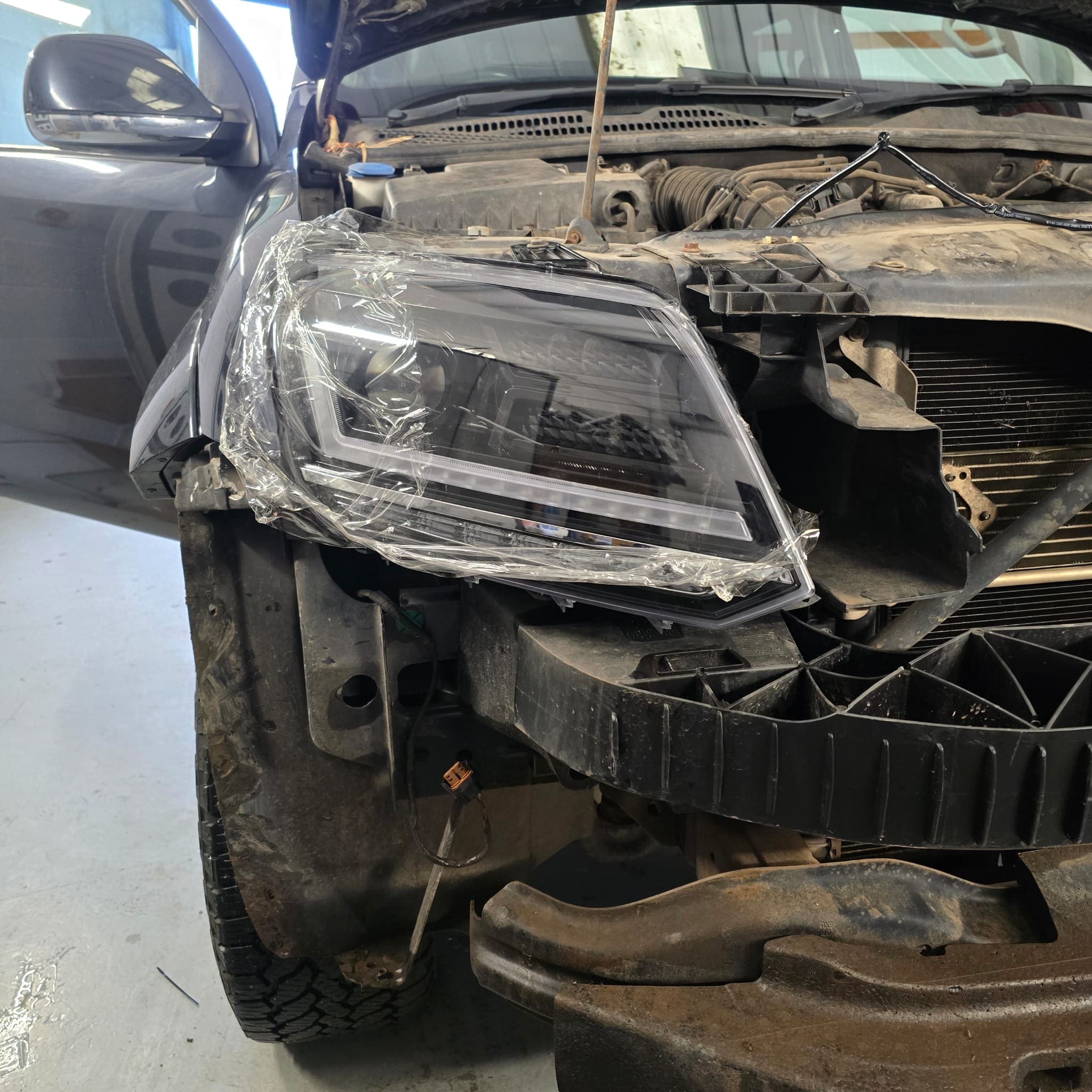 Final look of VW Amarok front end with black OSRAM LED headlamp upgrade