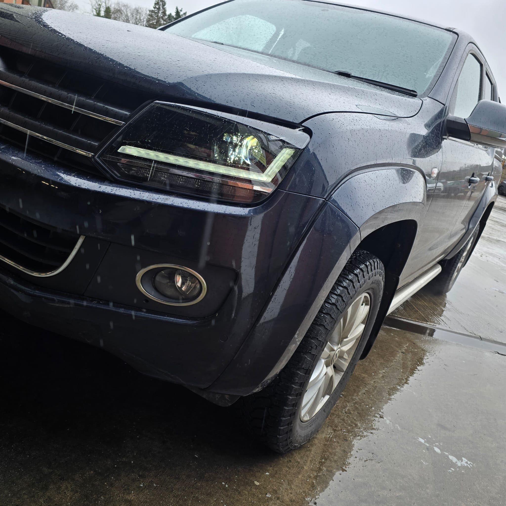 Front-end view after fitting black OSRAM LED headlamps to a VW Amarok