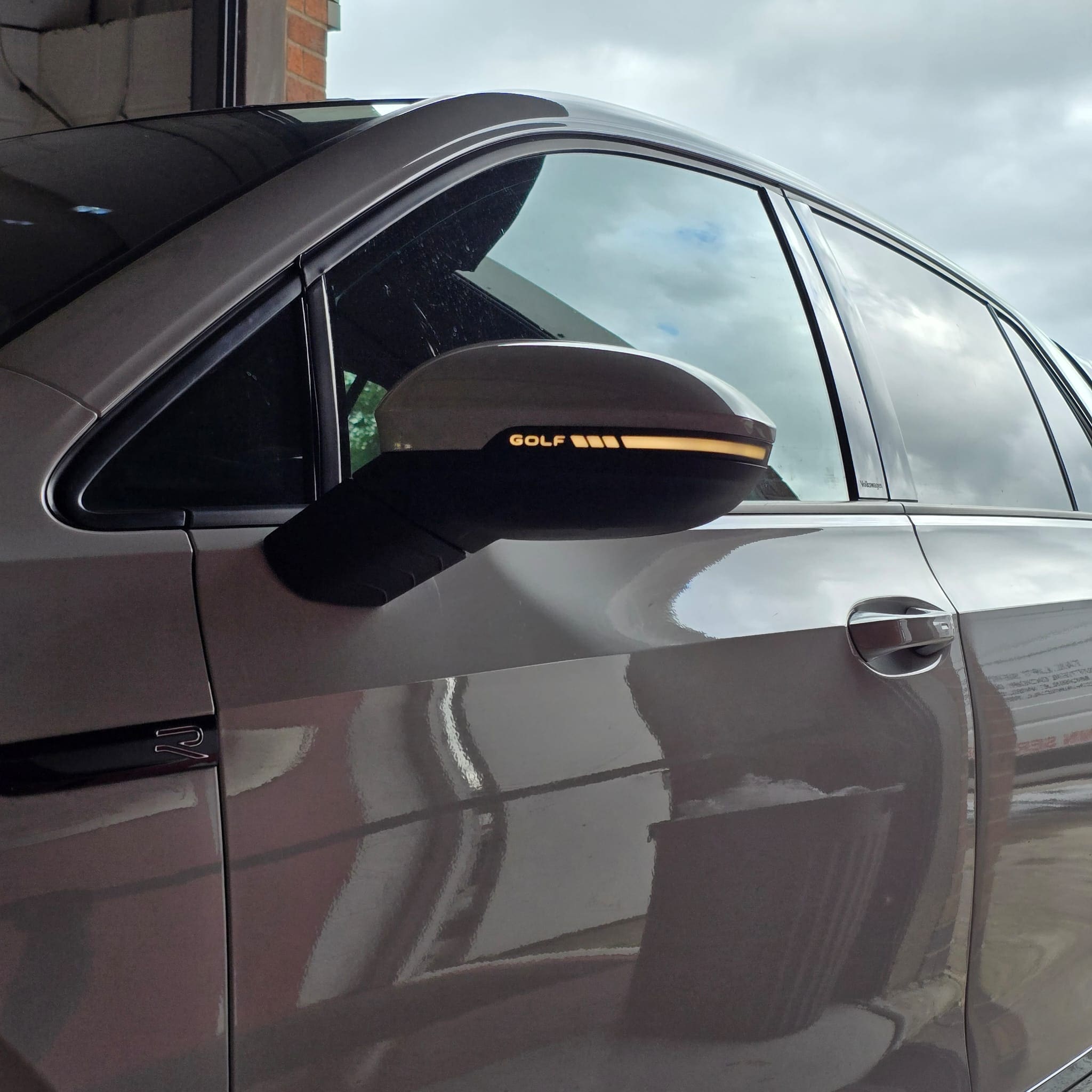 Detail shot of the GOLF writing on the VW Golf Mk8 sequential mirror indicator lens
