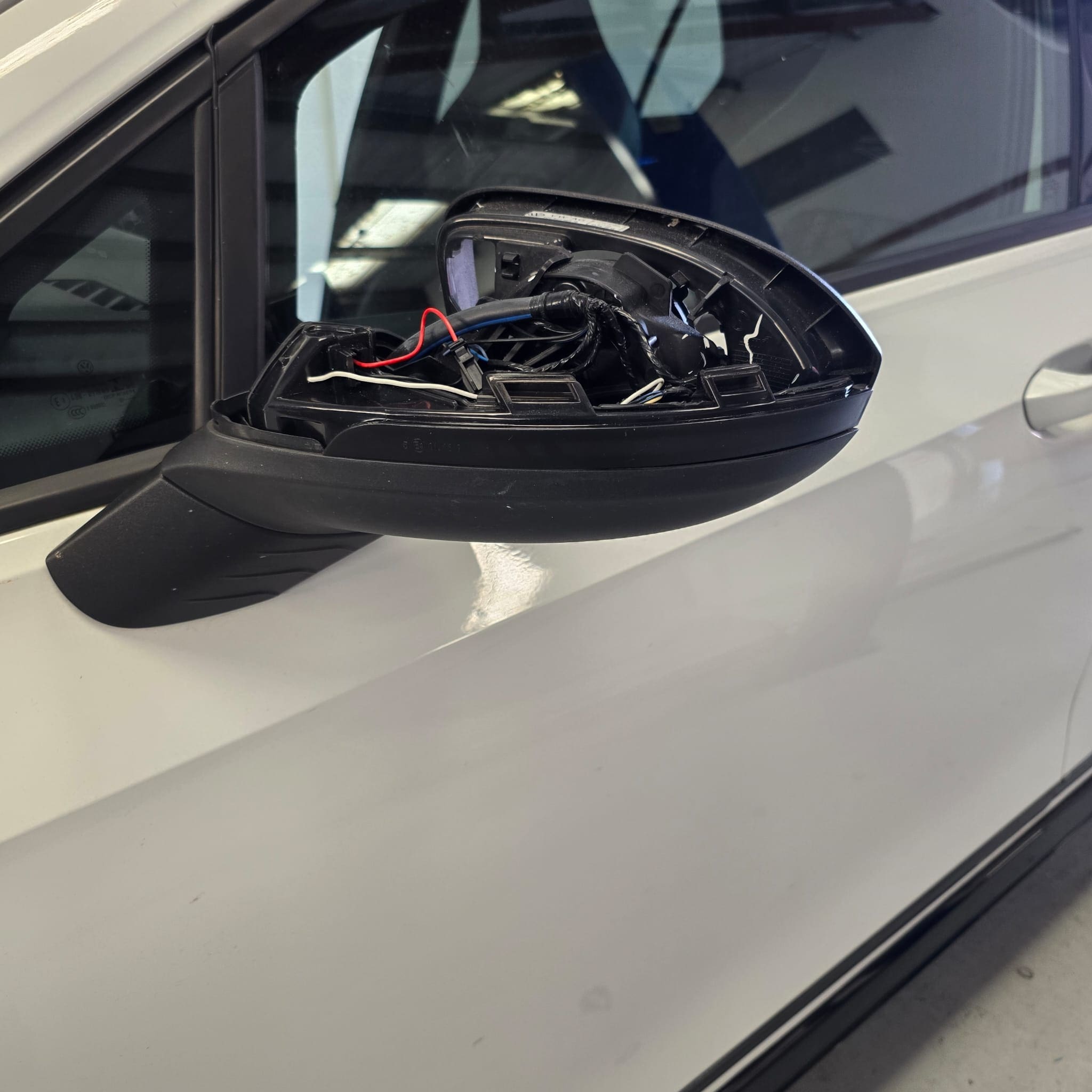 Workshop photo of VW Golf Mk8 after mirror indicator retrofit completion