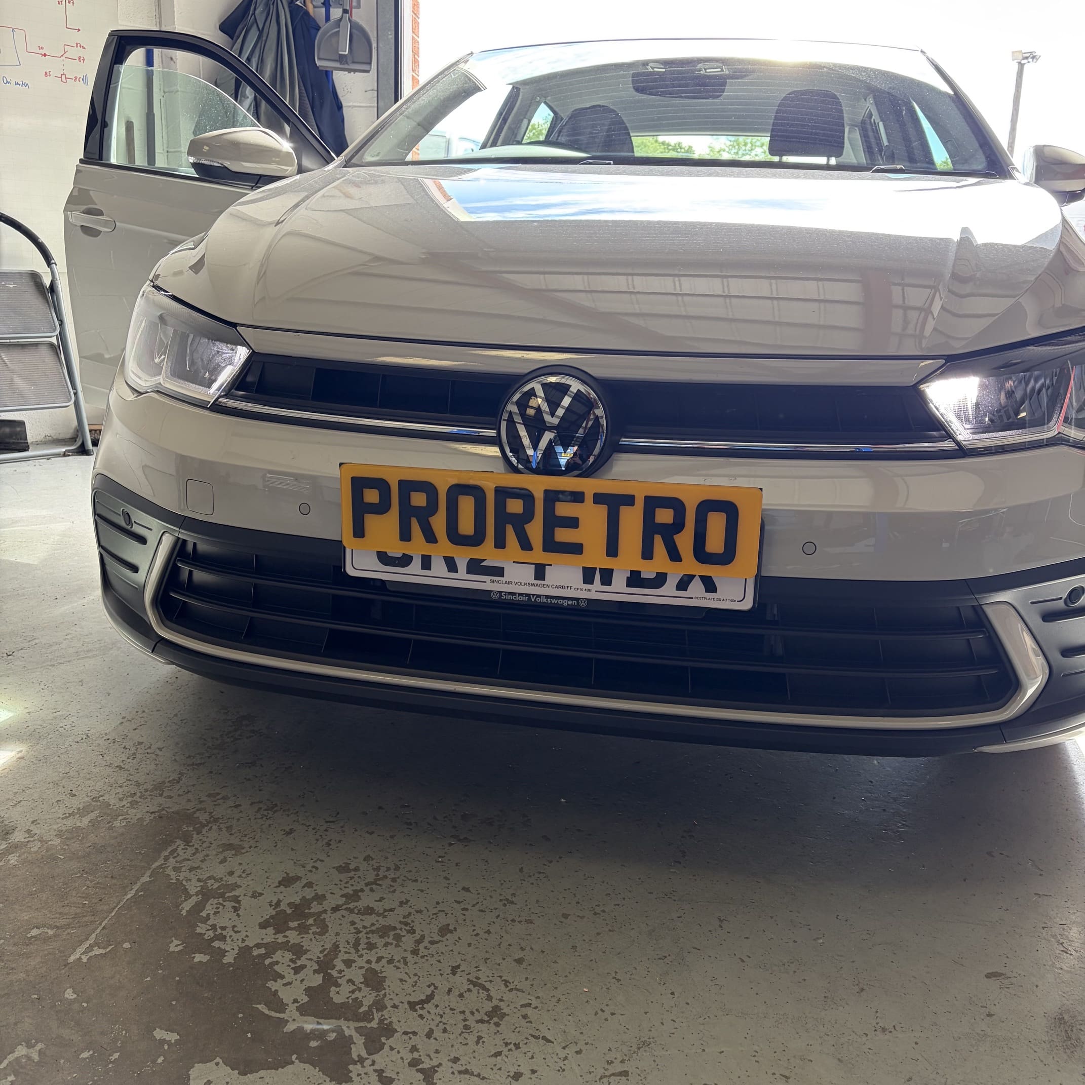 VW Polo AW with flush-fit front parking sensor retrofit installed in the front bumper