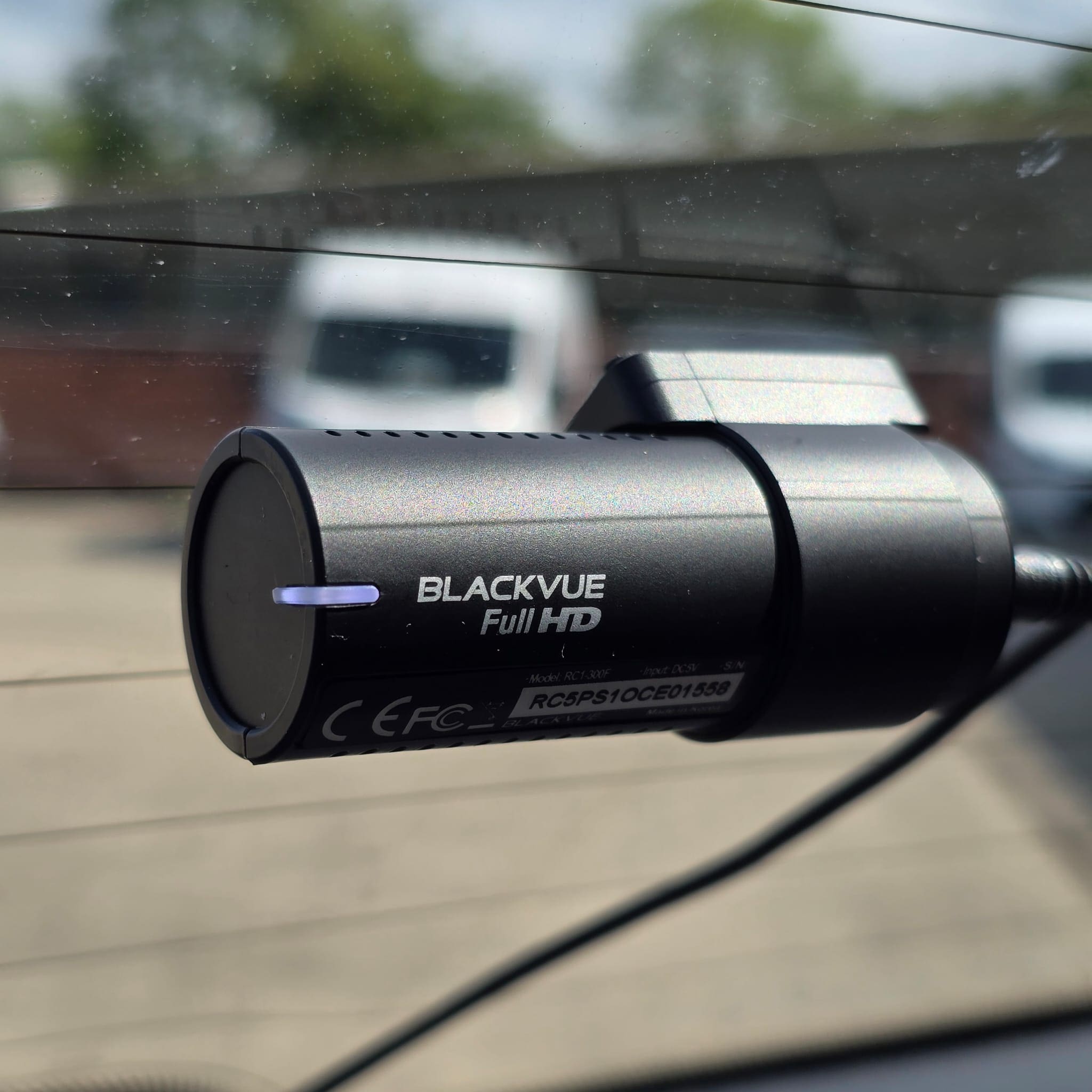 BlackVue rear dash camera positioned for clear rear recording in a VW Polo
