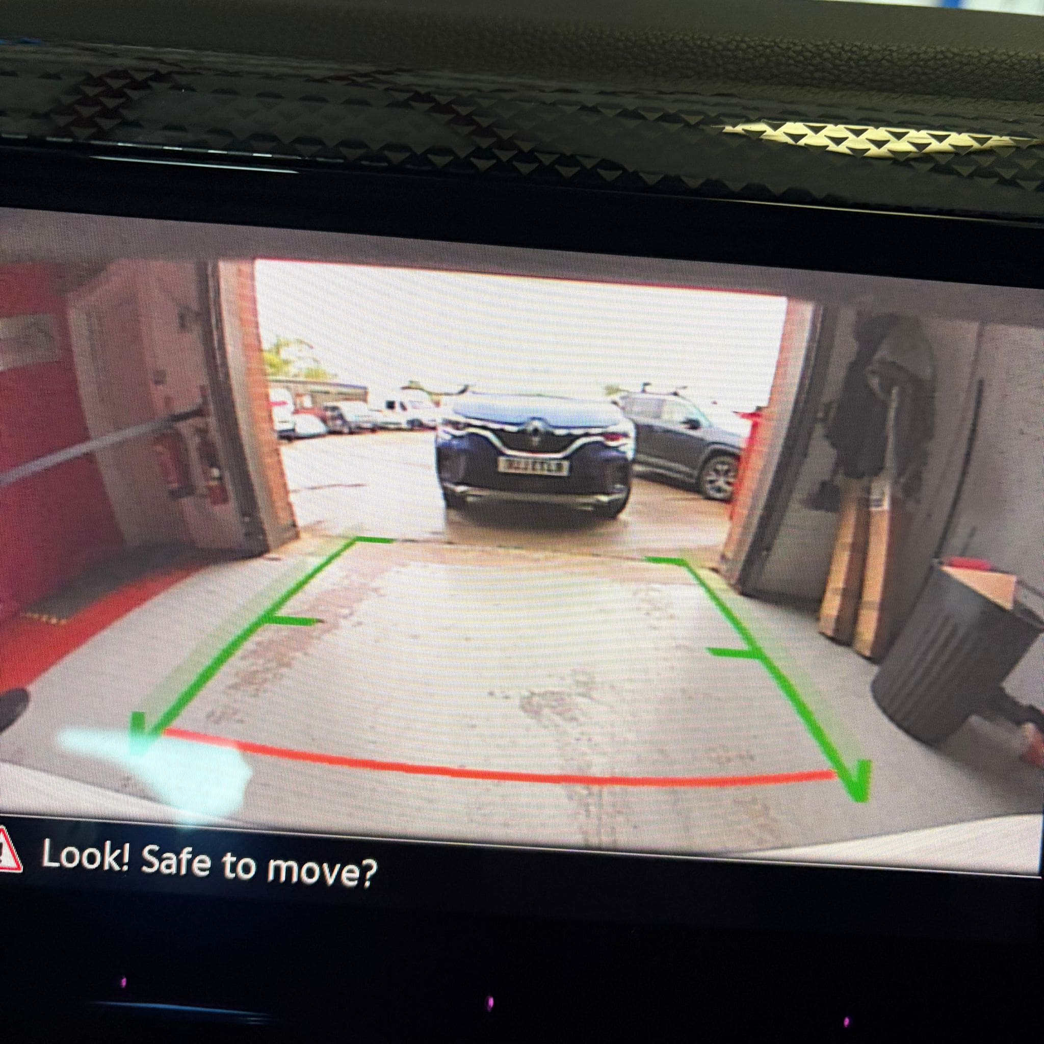 Rear view camera retrofit hardware fitted to VW Polo AW tailgate badge area