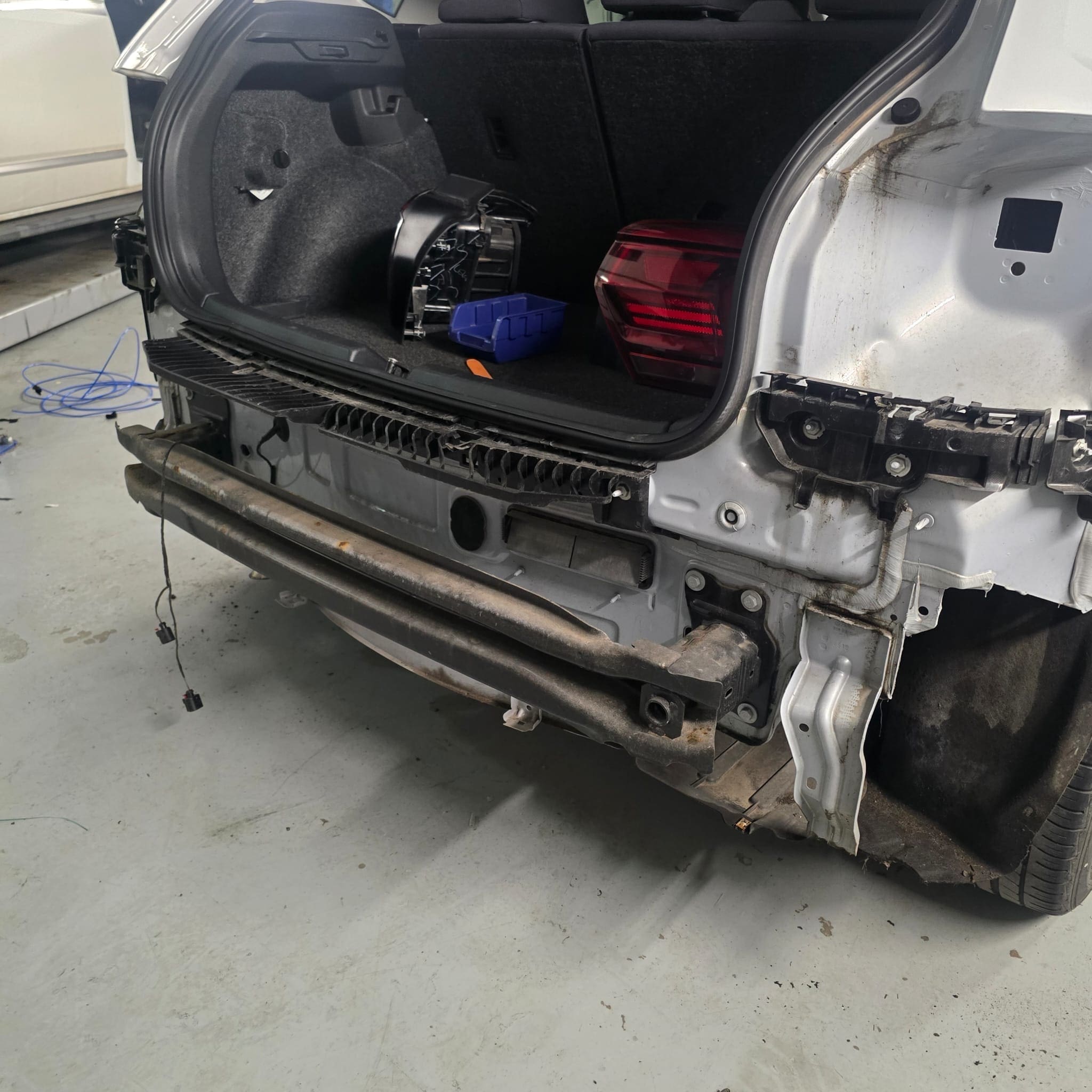Close-up of VW Polo rear sensor head sitting flush with bumper surface