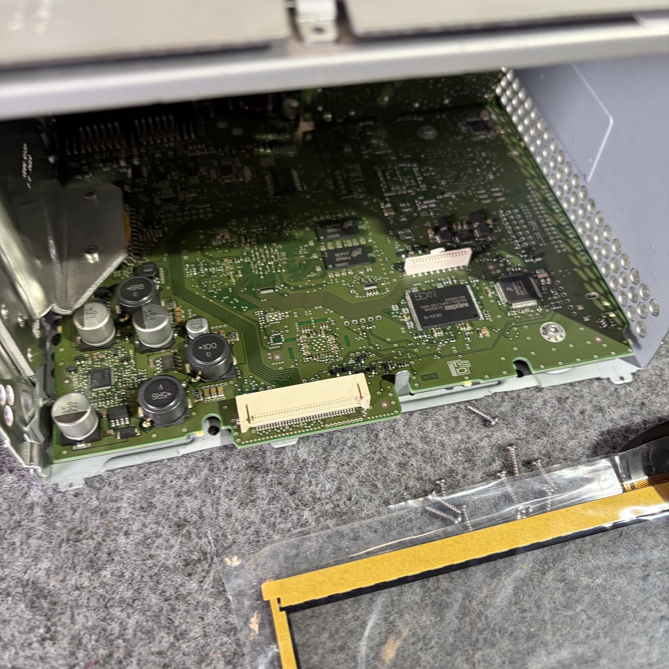 Close view of VW sat nav screen fault repair in progress