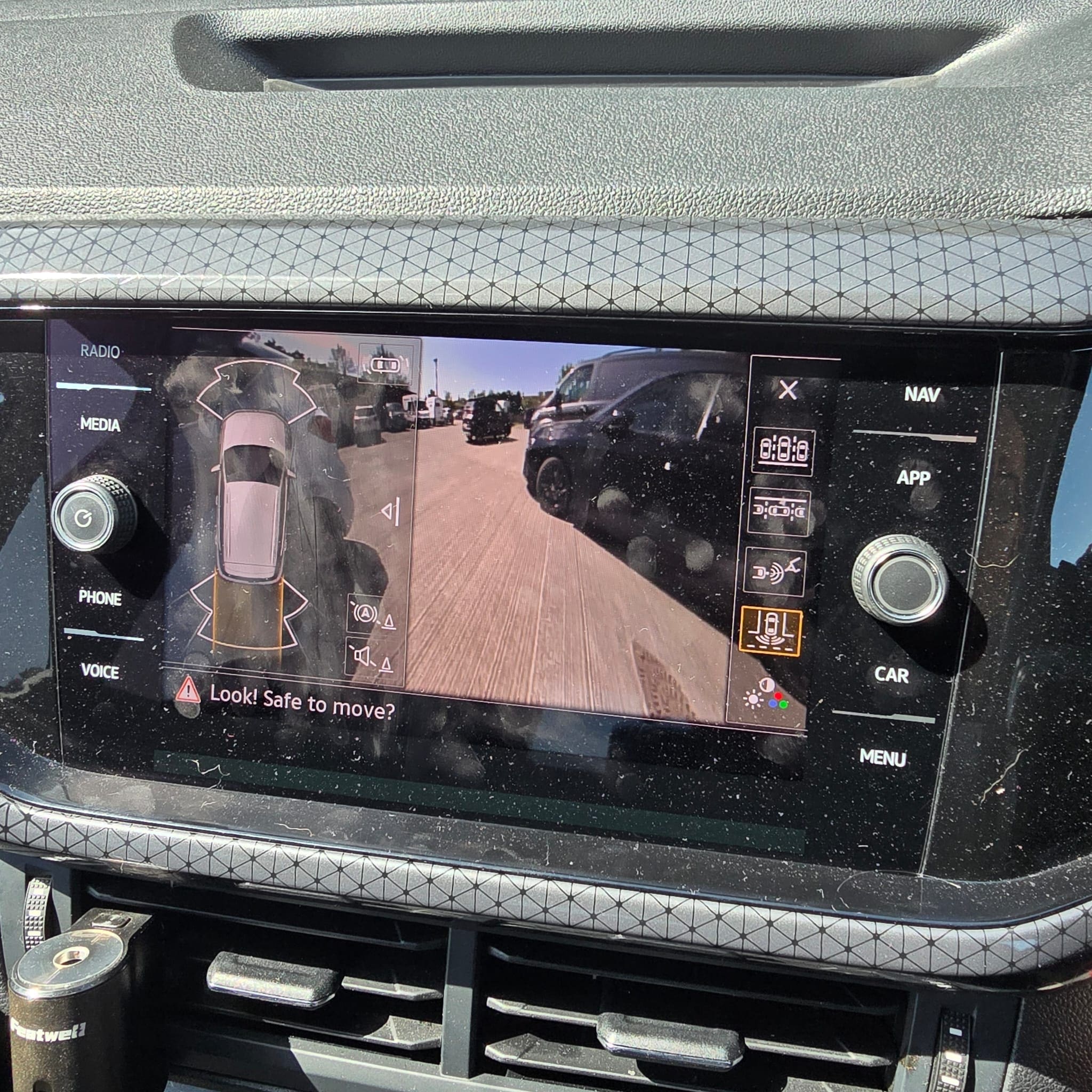 Completed VW T-Cross Highline OEM rear view camera retrofit showing full integration