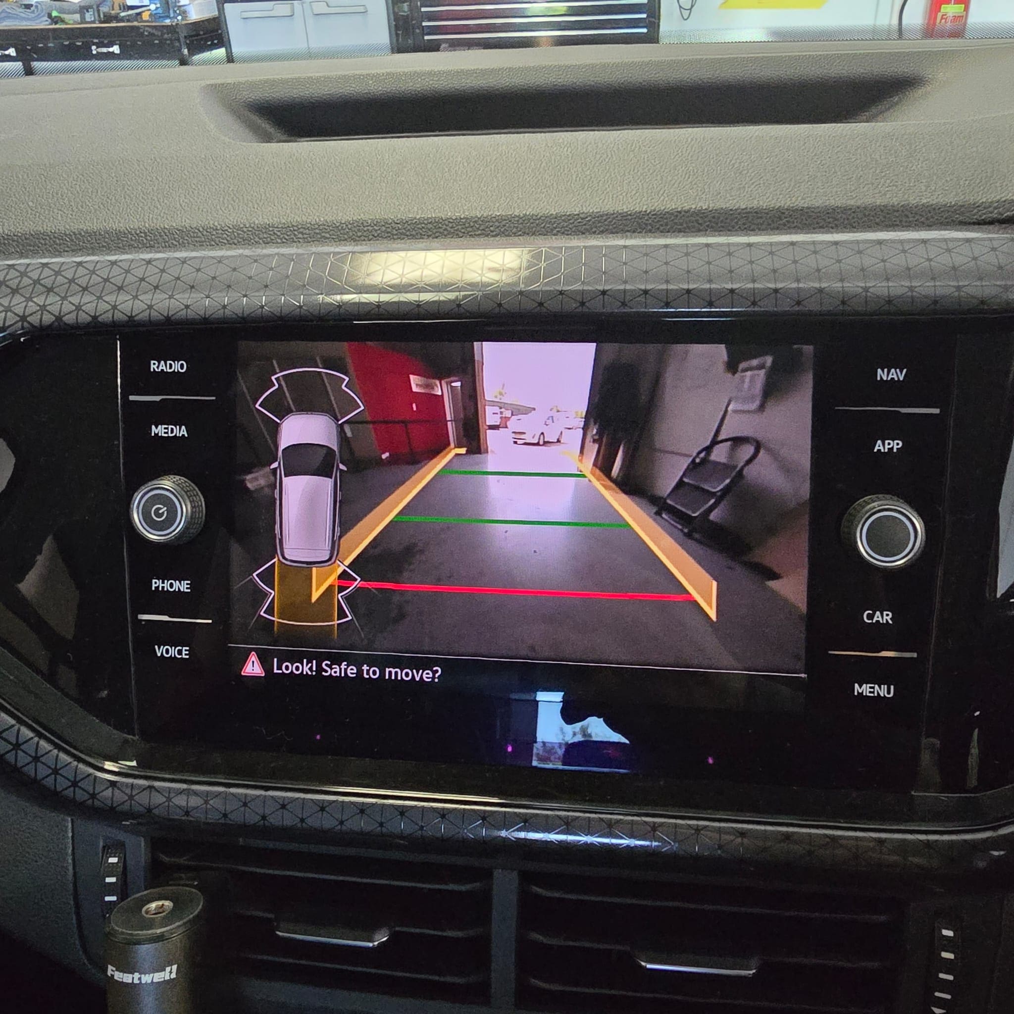 OEM-style wiring route used during VW T-Cross rear view camera installation