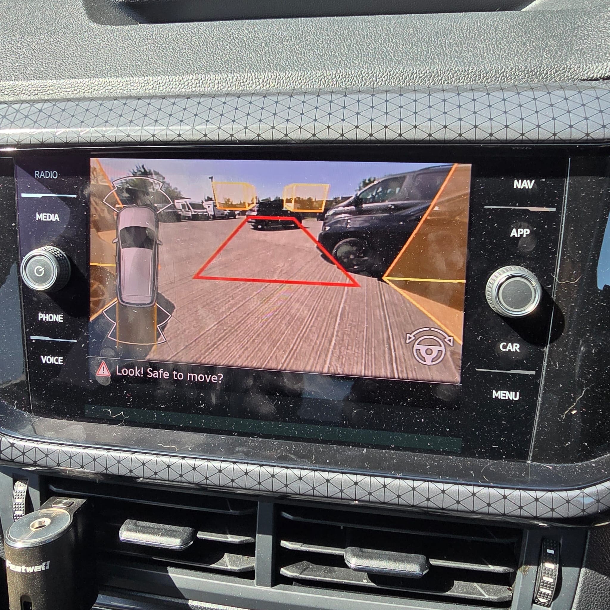 Rear view camera image on VW T-Cross display with parking assist modes available