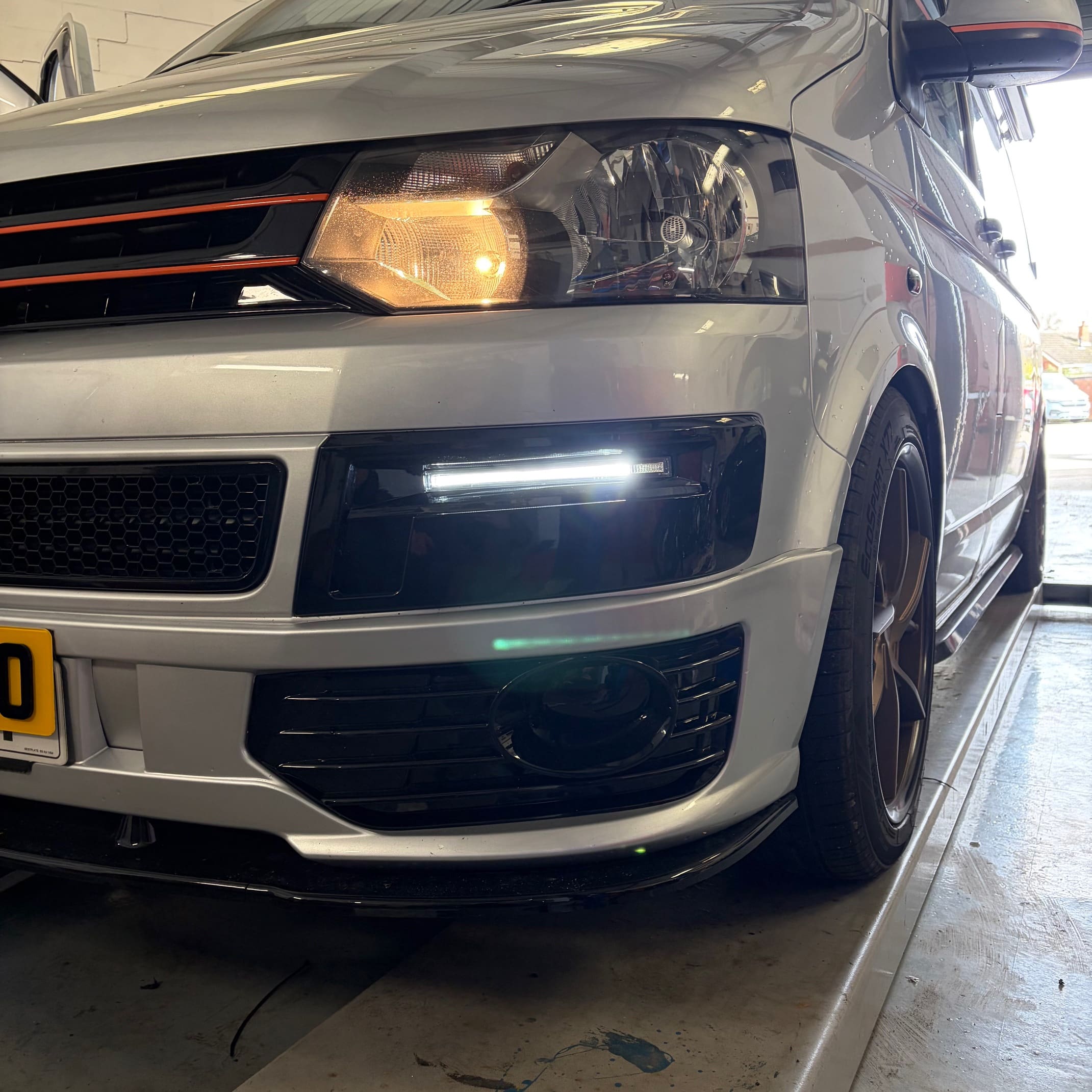 Front-end view of a VW T5.1 showing the OEM-style DRLs fitted for a cleaner look
