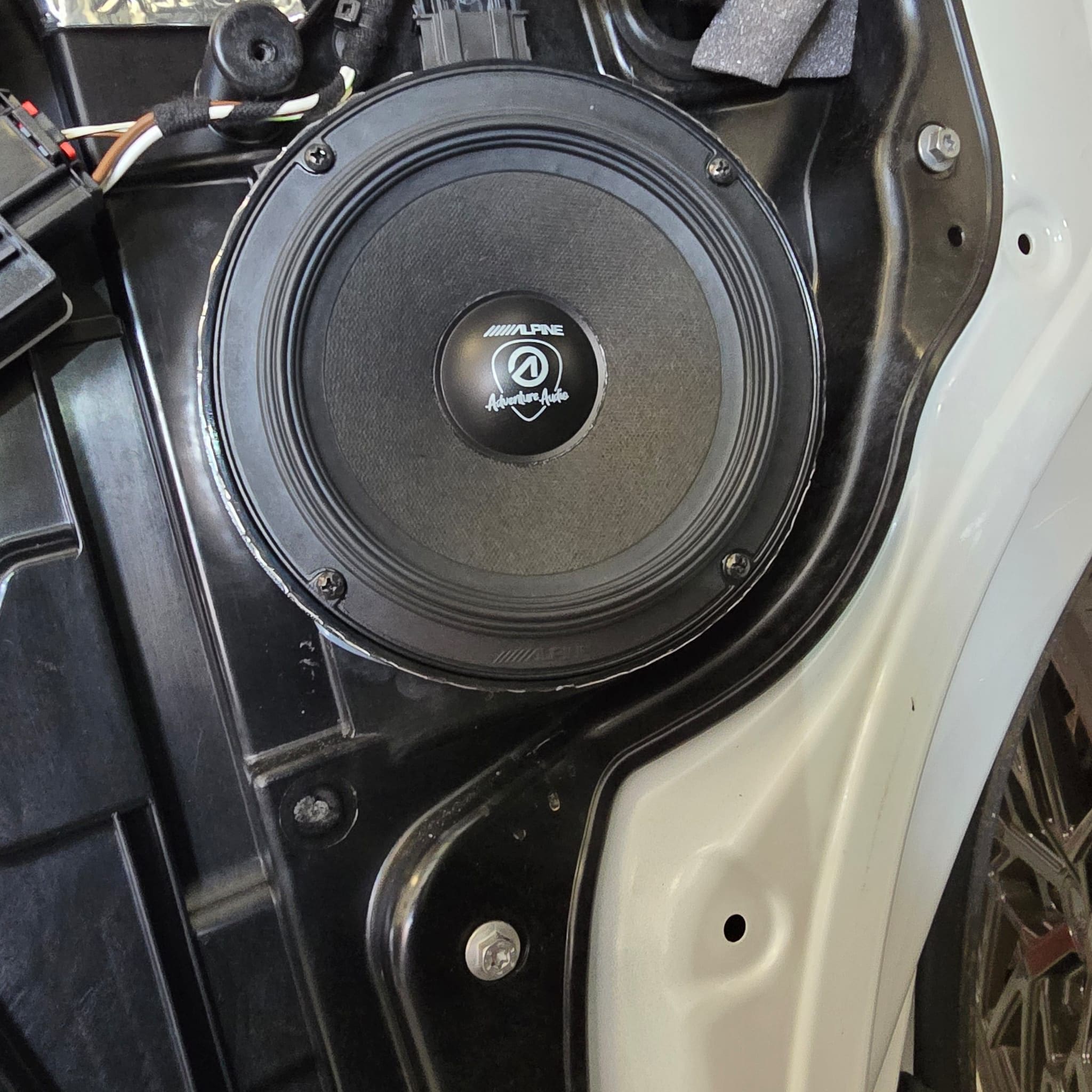 Close-up of VW T6.1 dash area showing Alpine Halo 9 positioned neatly after trimming work