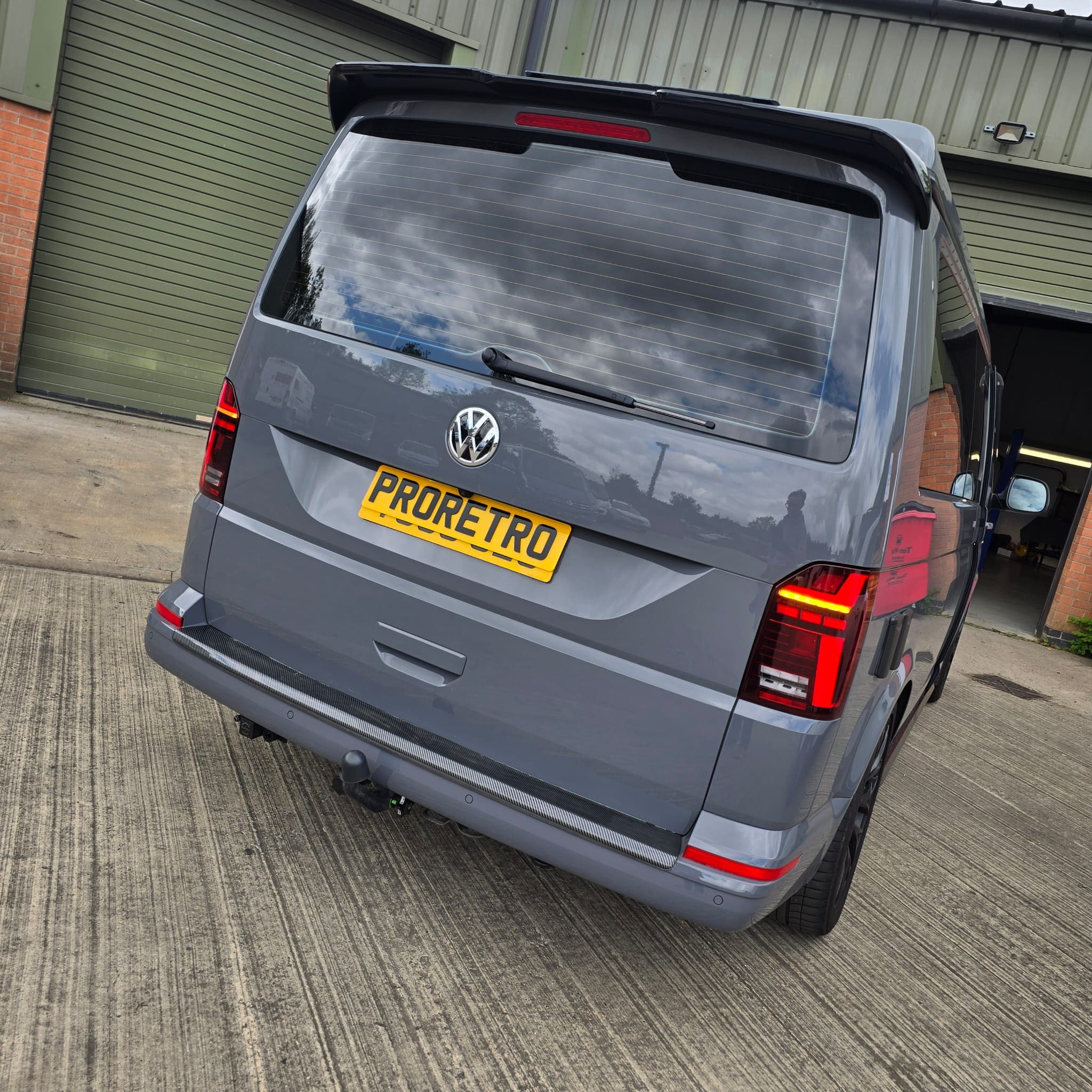 Ascot Grey VW T6.1 after OEM smoked LED tail lights and Alpine Halo 9 install