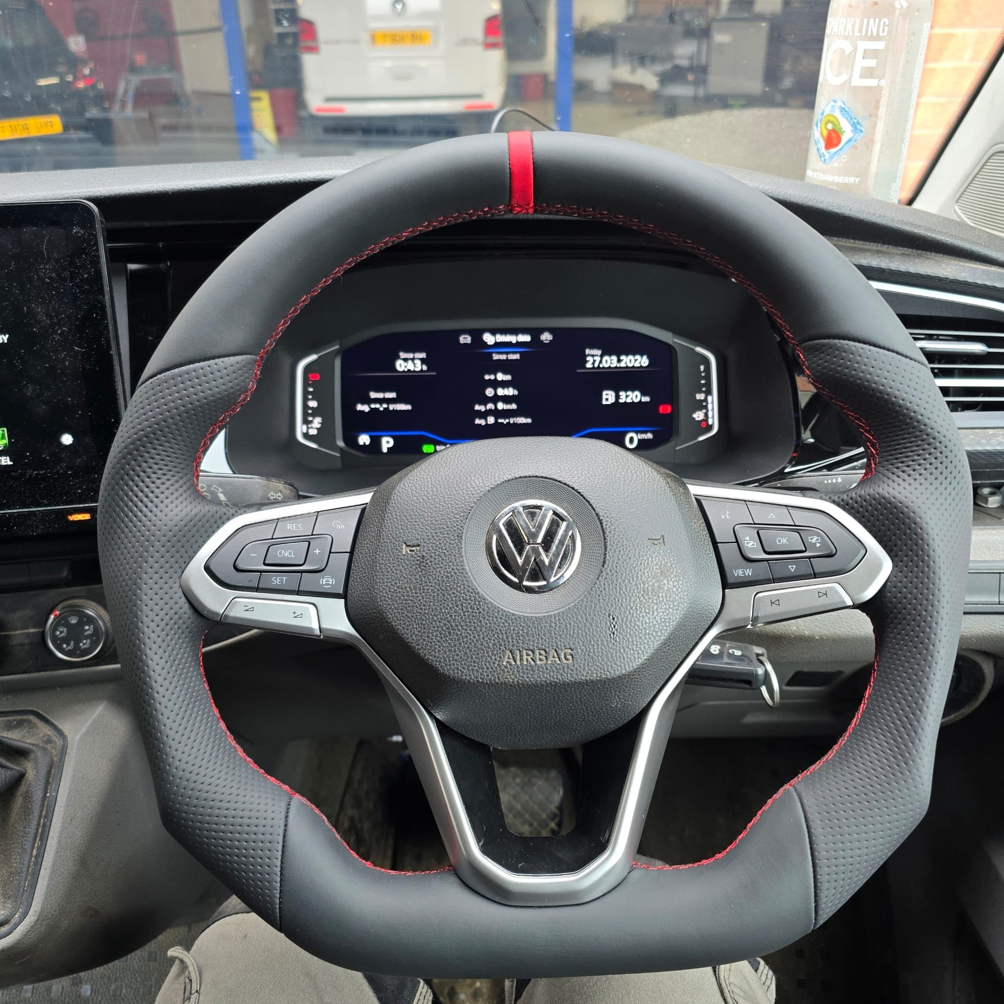 VW T6.1 interior close-up of the sport-looking reshaped and retrimmed BadBoy steering wheel