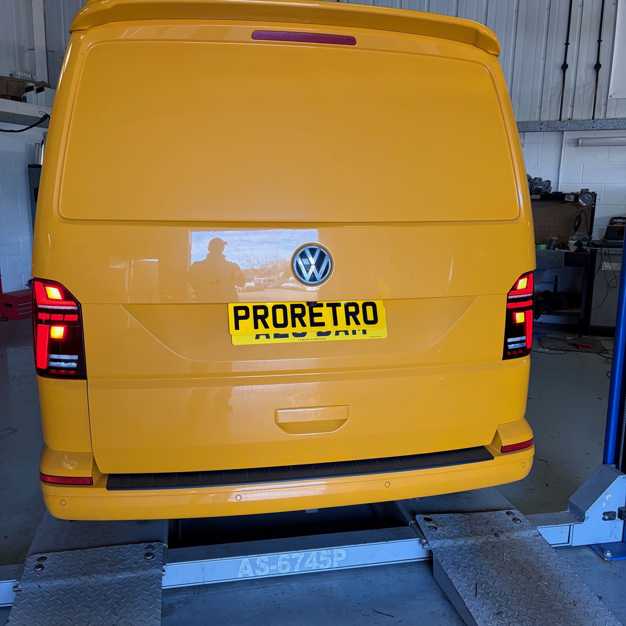VW T6.1 in the workshop with genuine smoked LED taillights fitted during retrofit work