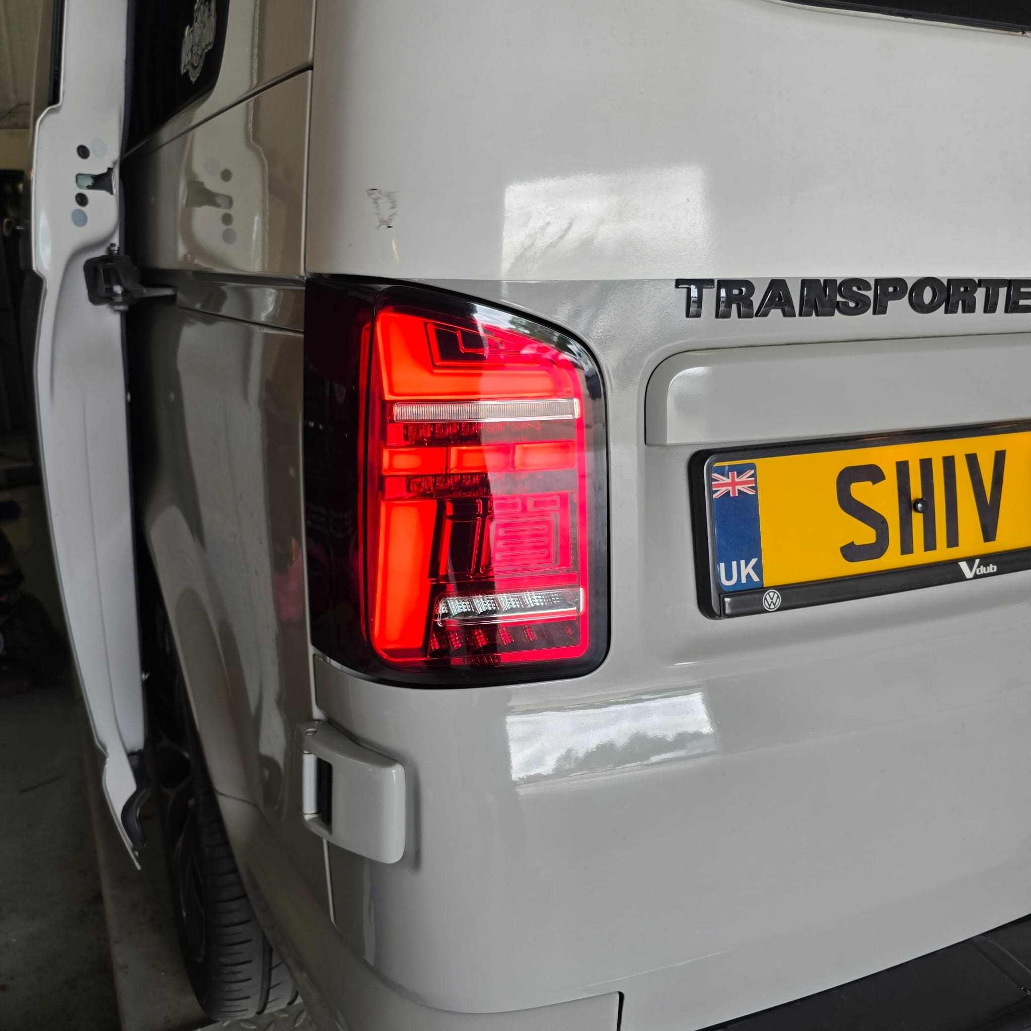 VW T6 barn door camper in the workshop after aftermarket LED tail lights were fitted