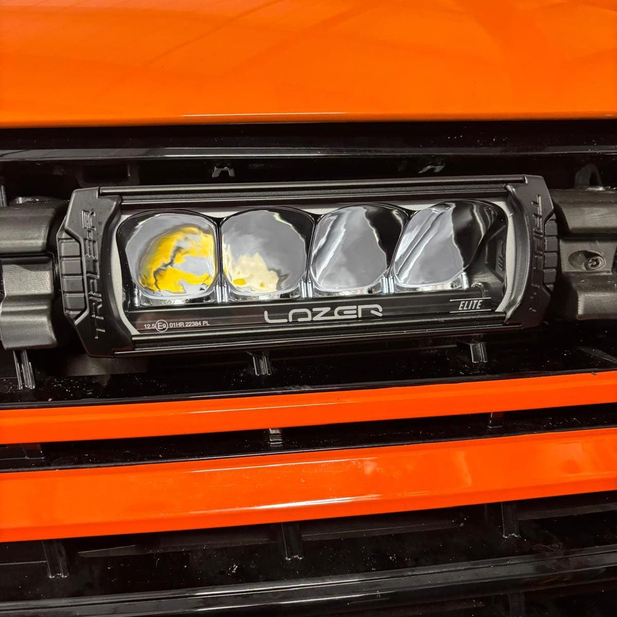 Close view of Lezer lights fitted to a VW T6 and integrated with high beam
