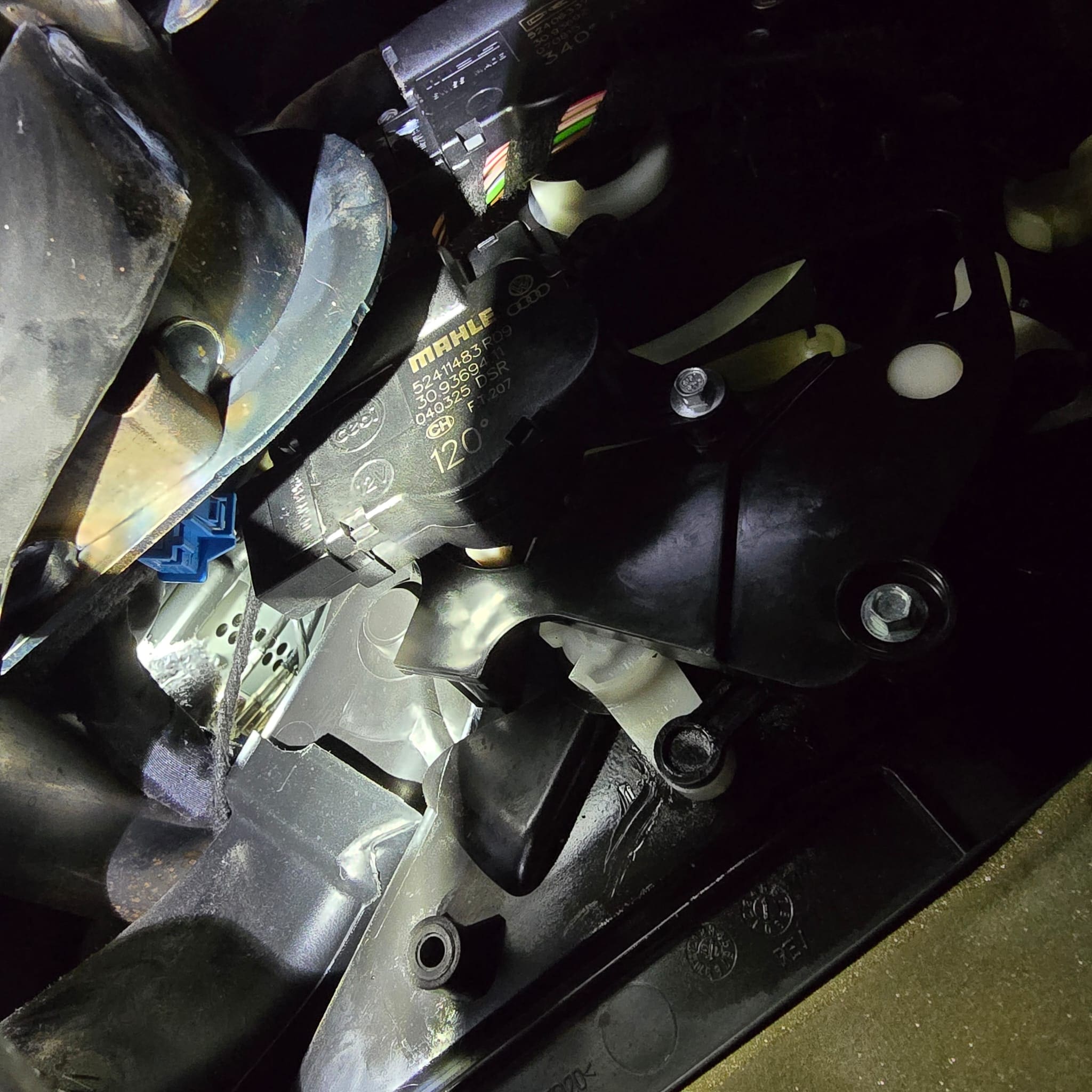 Heater flap actuator motor installation area on a VW Transporter during repair