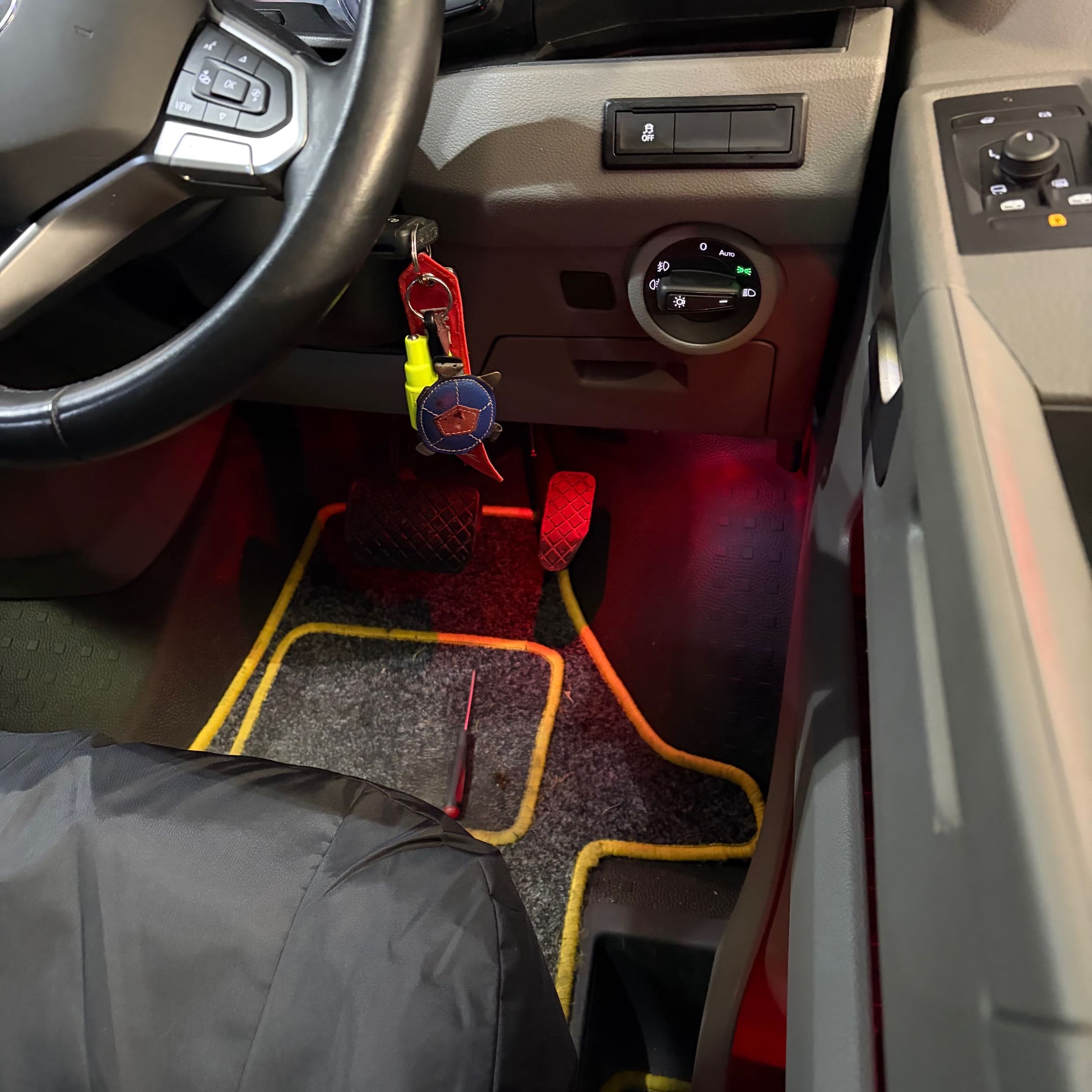 Red ambient lighting installed in the VW Transporter door card and footwell areas