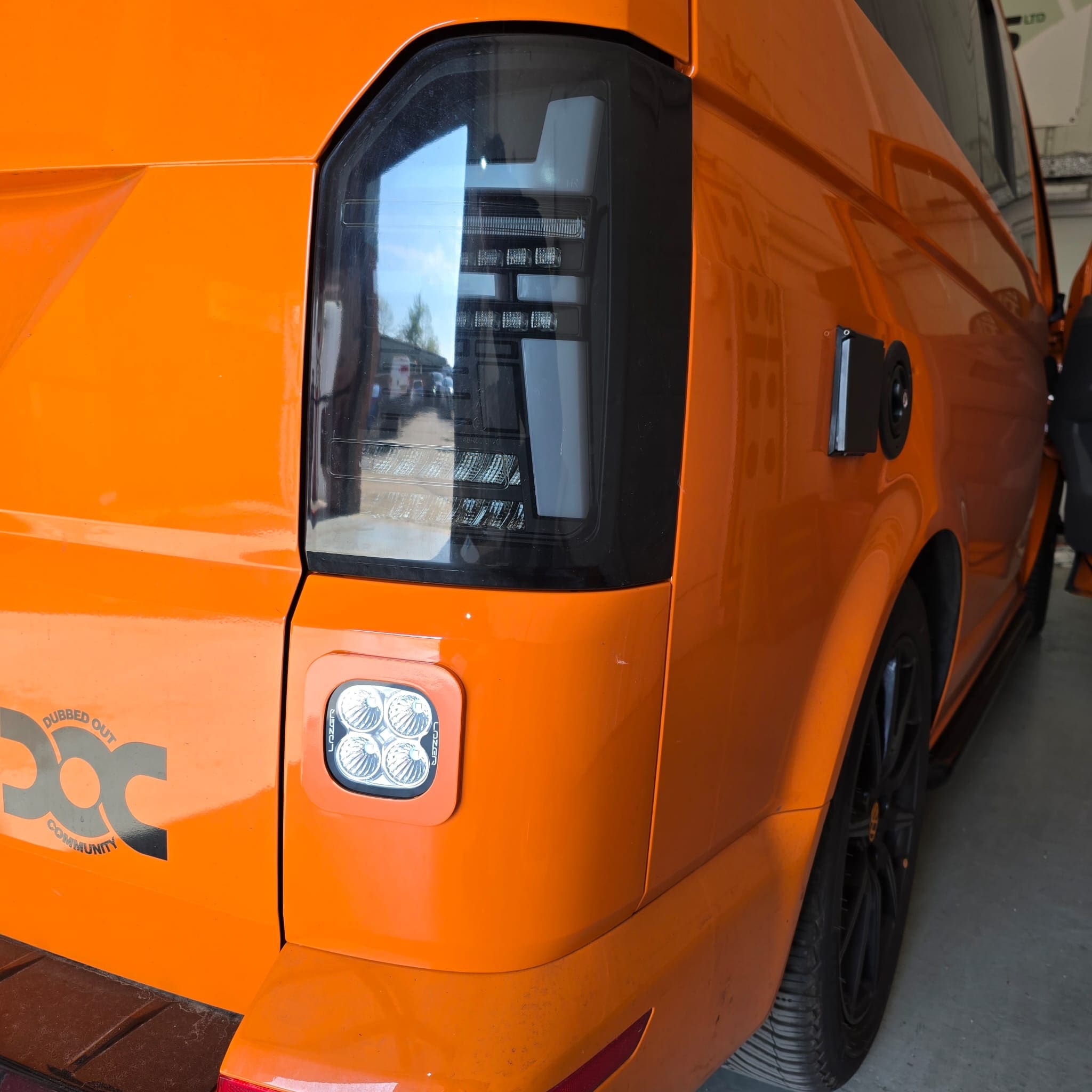 Close-up of painted reverse light pod blended into the rear bumper trim