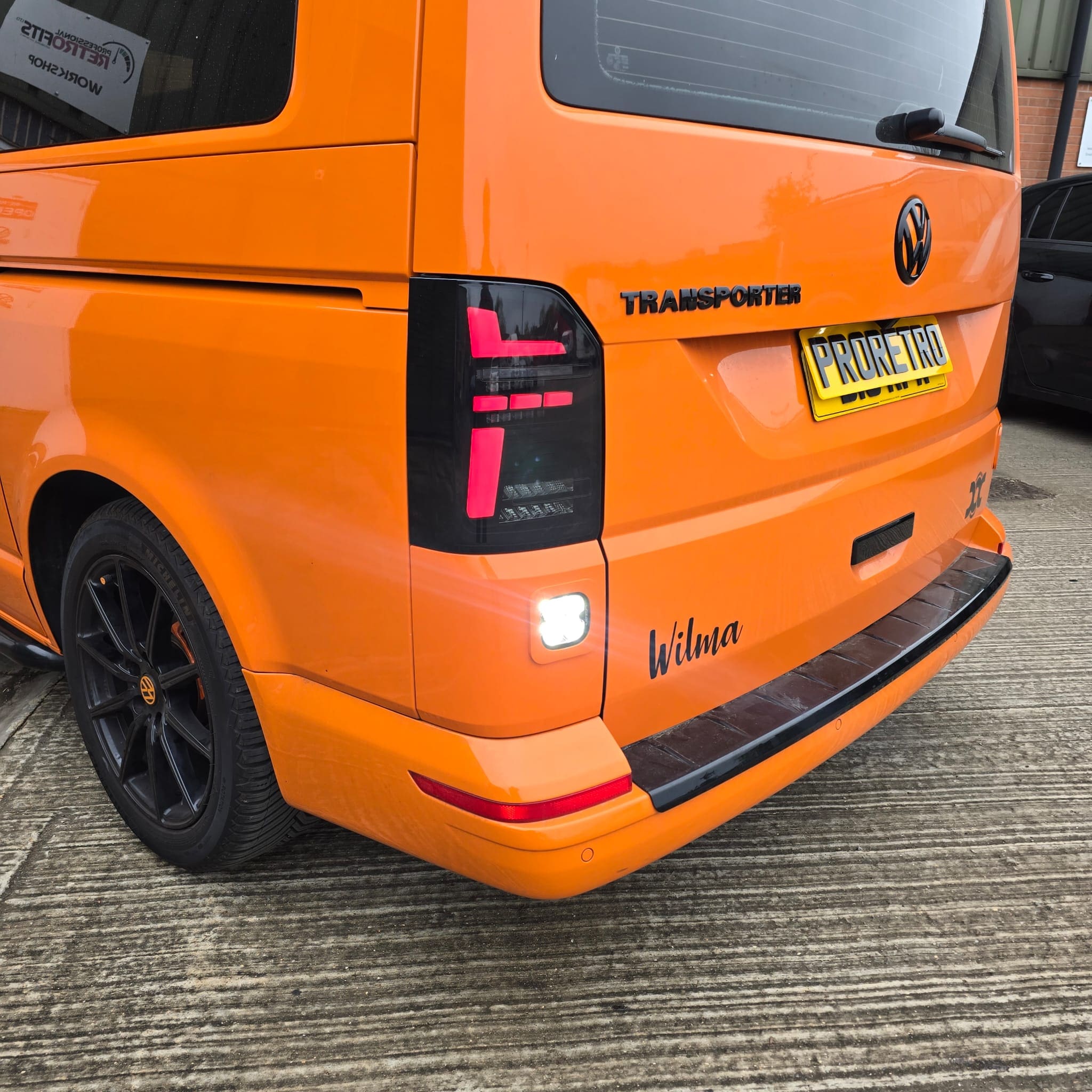 Finished look of both rear bumper trims with integrated reverse light pods installed
