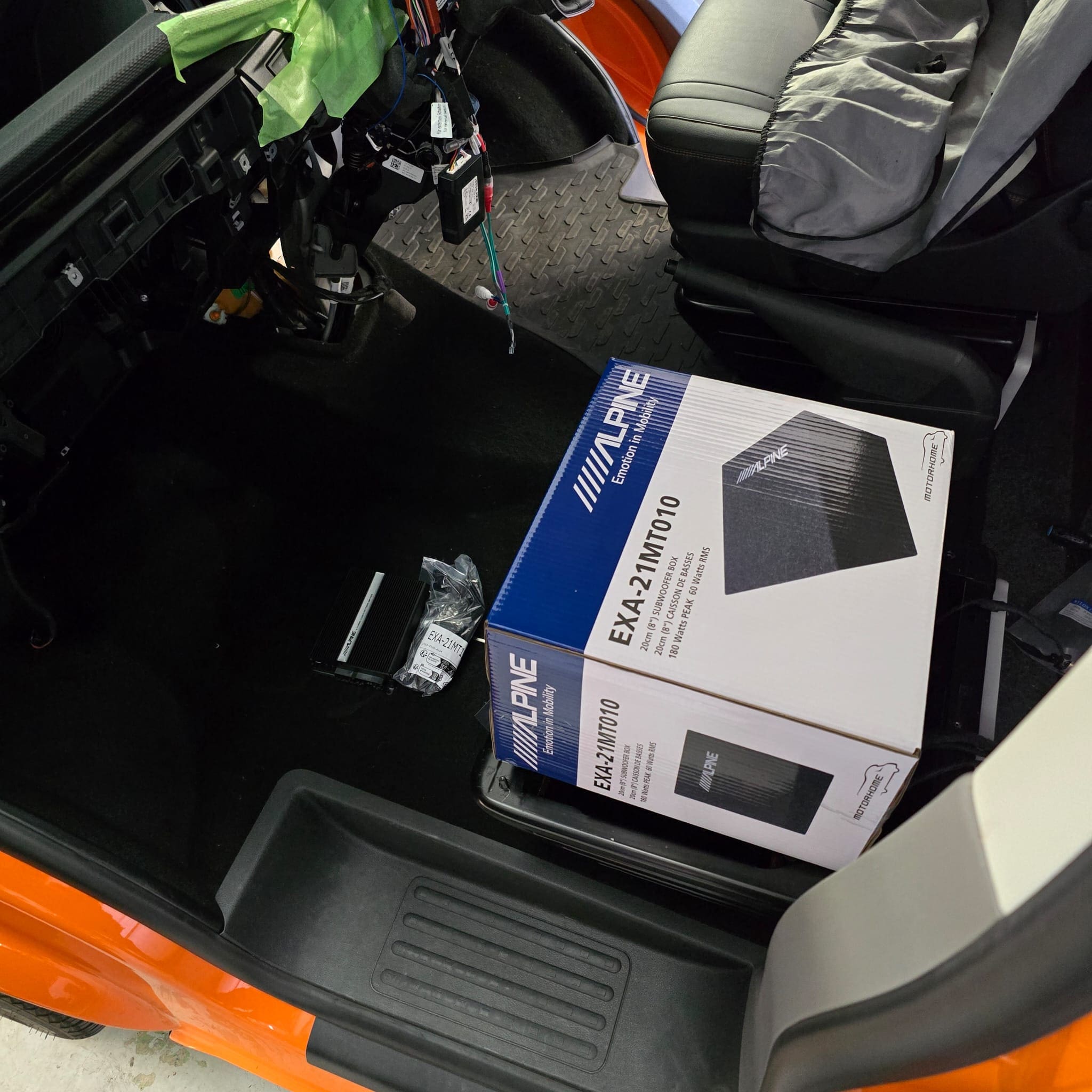Alpine SPC-W84AT6-2 subwoofer and amplifier installed under the passenger seat in a VW Transporter T6.1