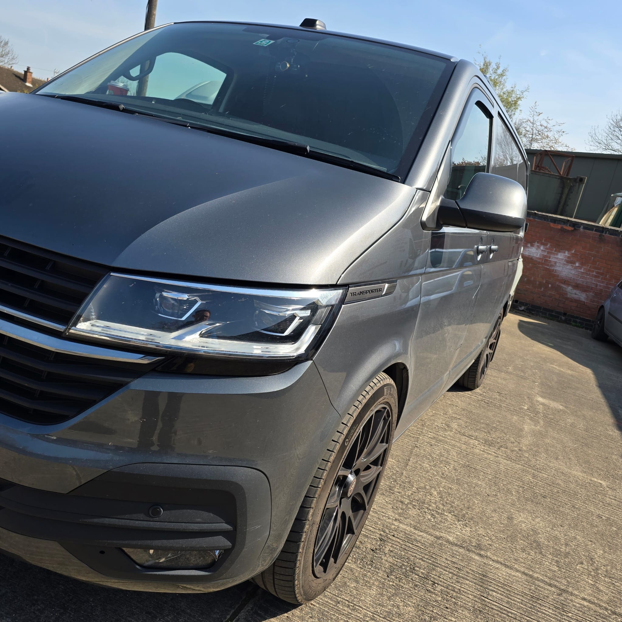 Replacement battery fitted in a VW Transporter T6.1 with terminals secured and checked