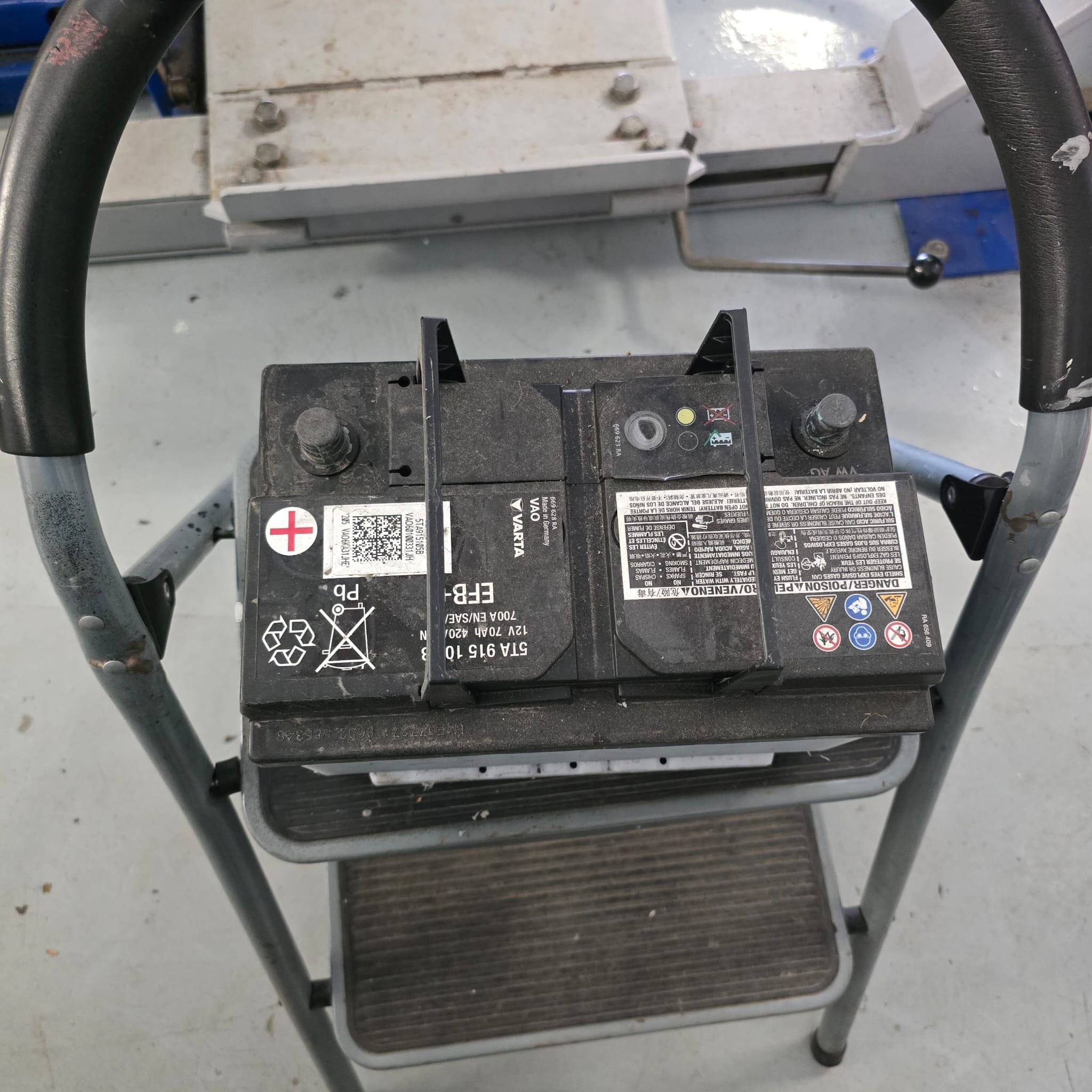 Close-up view of the Volkswagen Transporter T6.1 battery area during replacement and inspection
