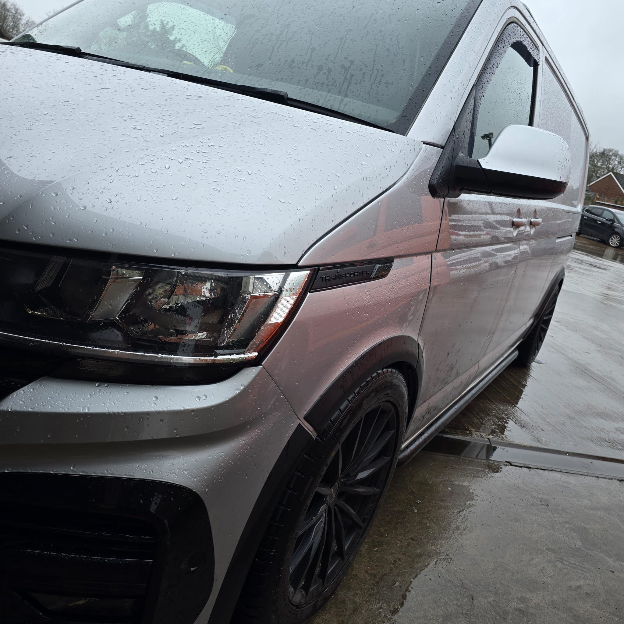 VW Transporter T6 retrofit featuring Mk7 Golf carbon fibre steering wheel with black stitching, blue 12 o'clock band, cruise buttons and DSG paddles enabled