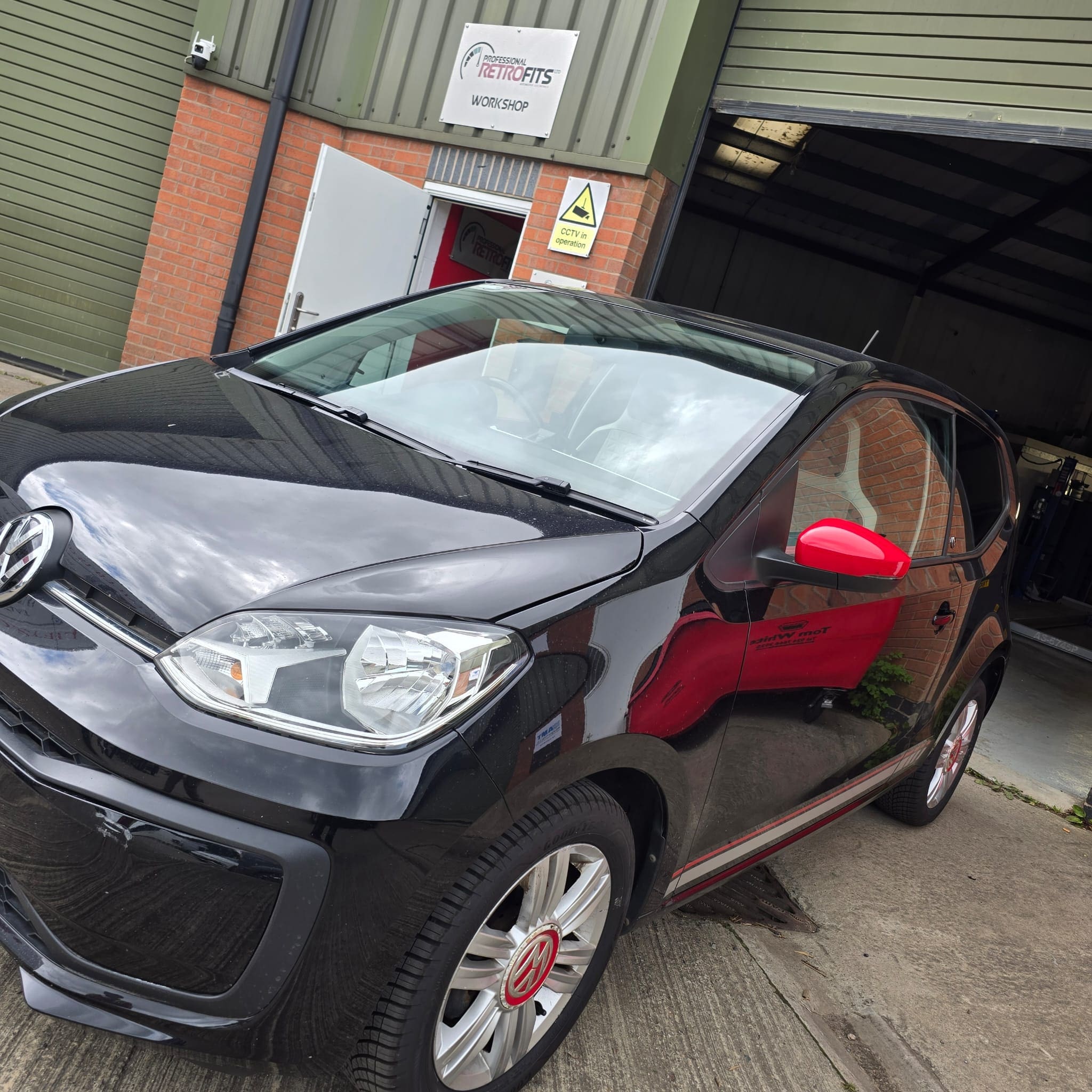 Completed VW Up rear parking sensor retrofit providing extra confidence for a new driver