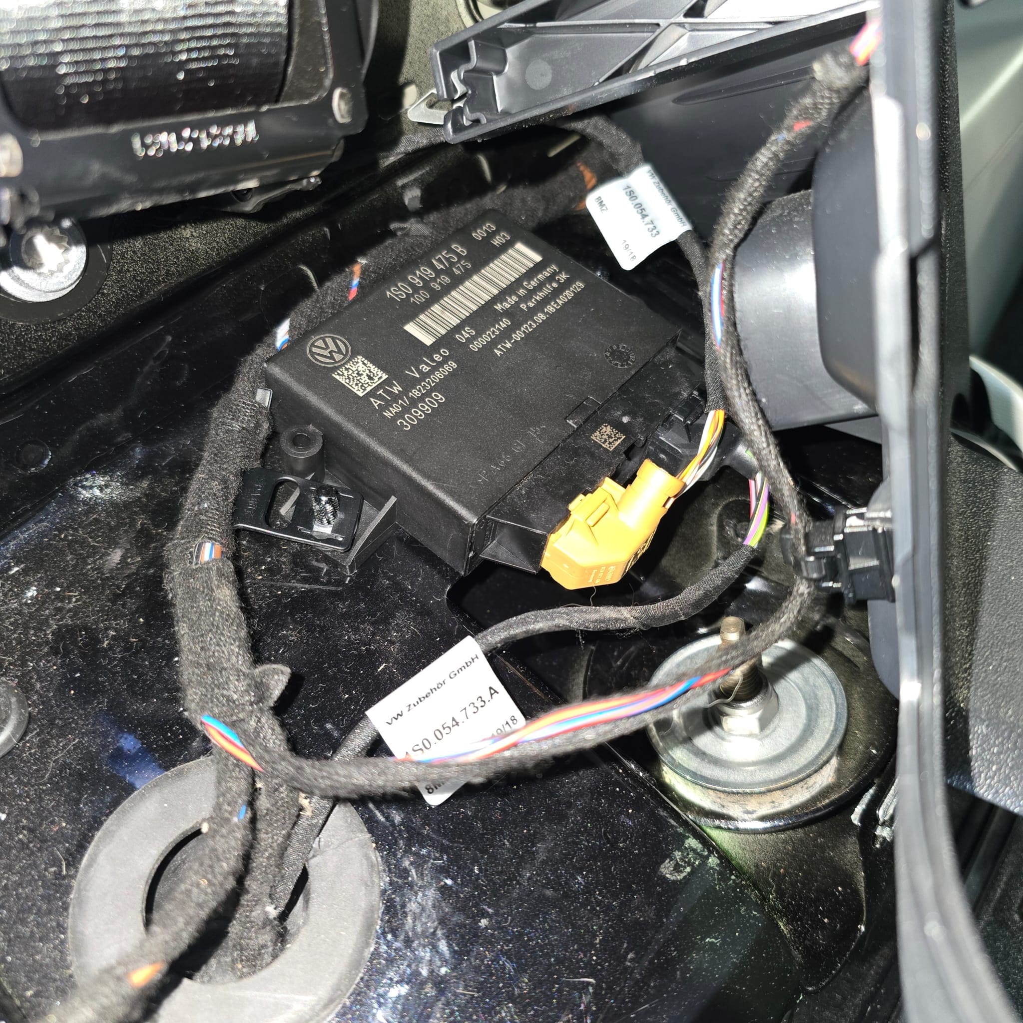 Close view of OEM-style parking sensors fitted to the rear of a VW Up for tight parking spots