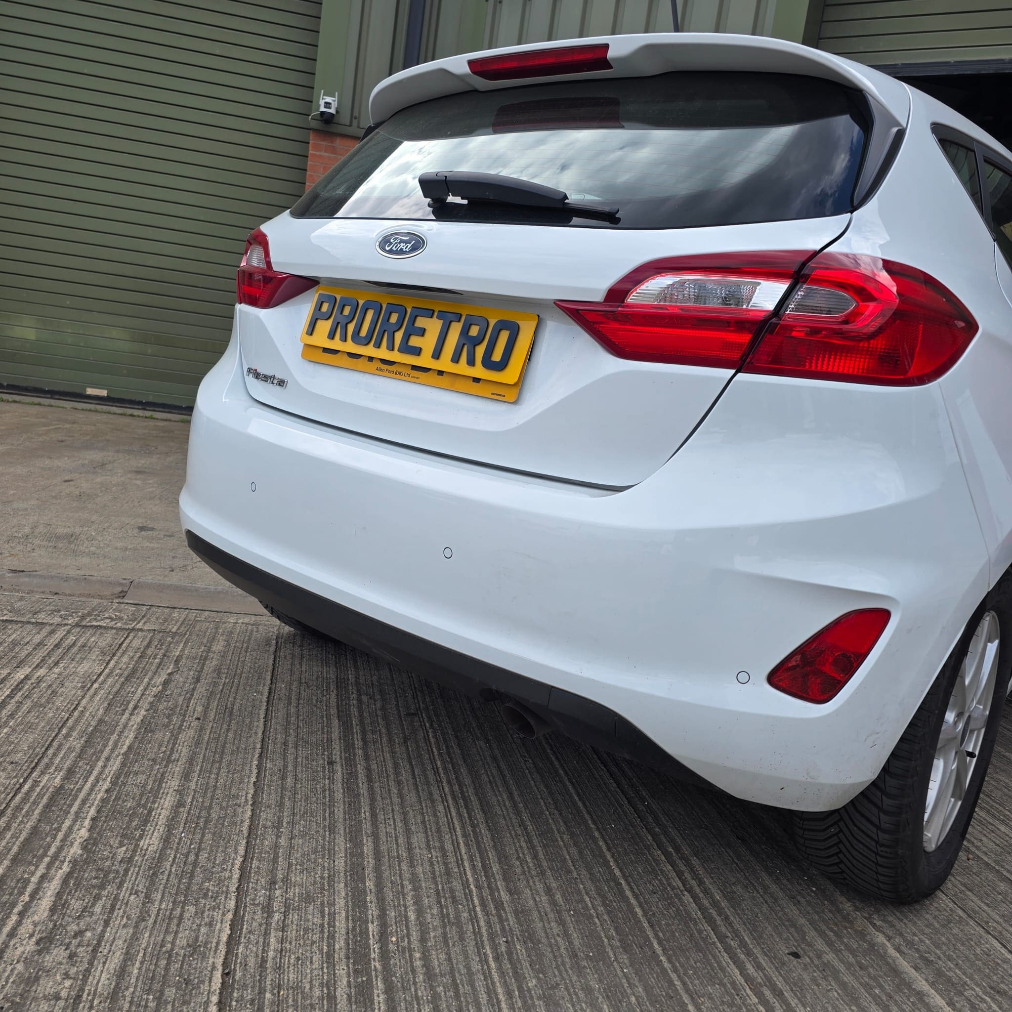 Close-up of flush fit rear parking sensor installed on the Ford Fiesta bumper