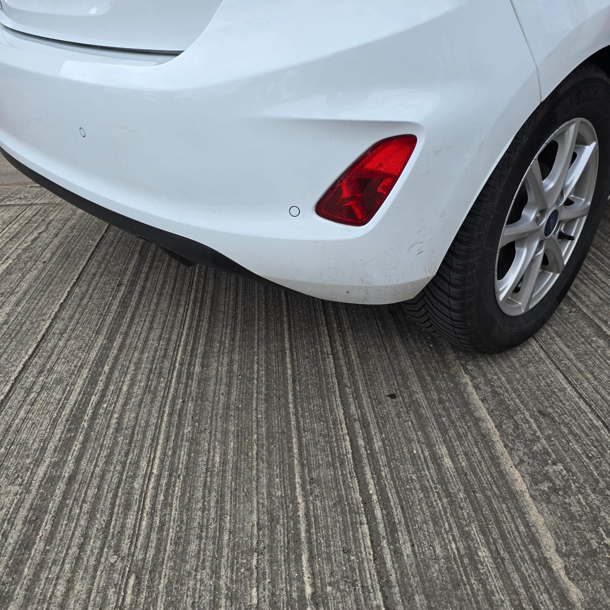 White Ford Fiesta 2018 parked in the workshop ready for rear parking sensors retrofit