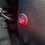 Aftermarket heated seat temperature switch mounted in seat base trim